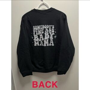 Woman’s black crewneck